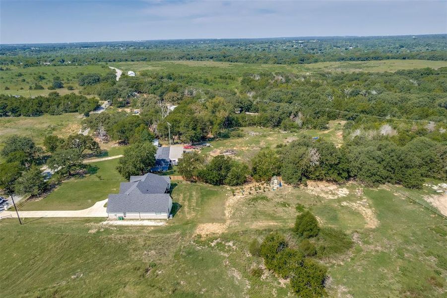 Aerial overview of property's location featuring a forest