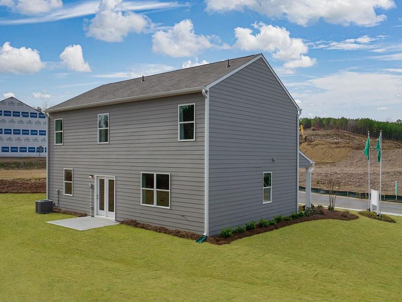 Exterior details and patio area of a home in Oaks at Cedar Grove, Fairburn (Image 24).