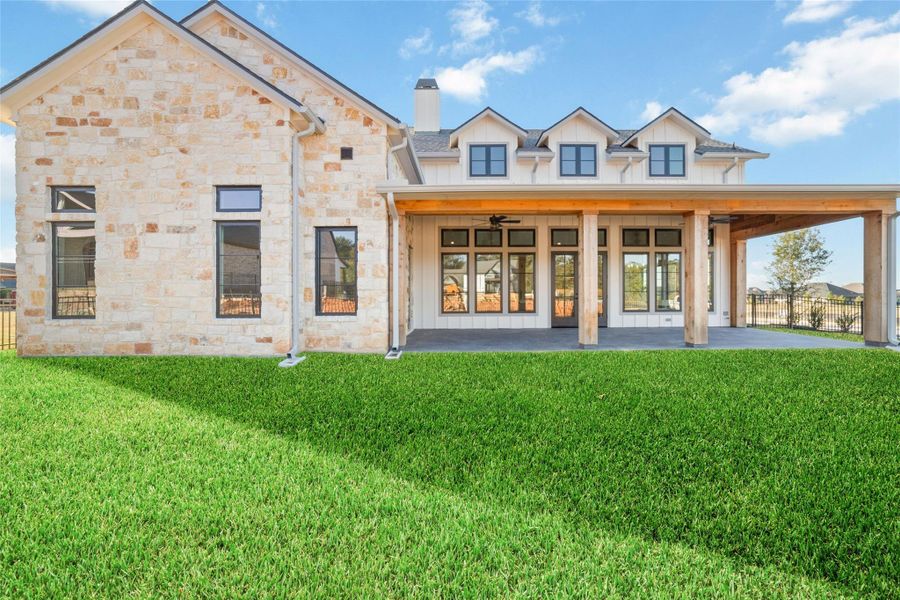 Expansive backyard with lush green lawn and plenty of room for outdoor living.