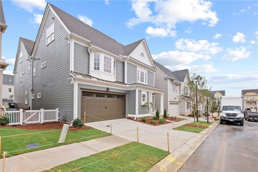 Front exterior of a new home in , Woodstock, GA, highlighting curb appeal (Image 23).