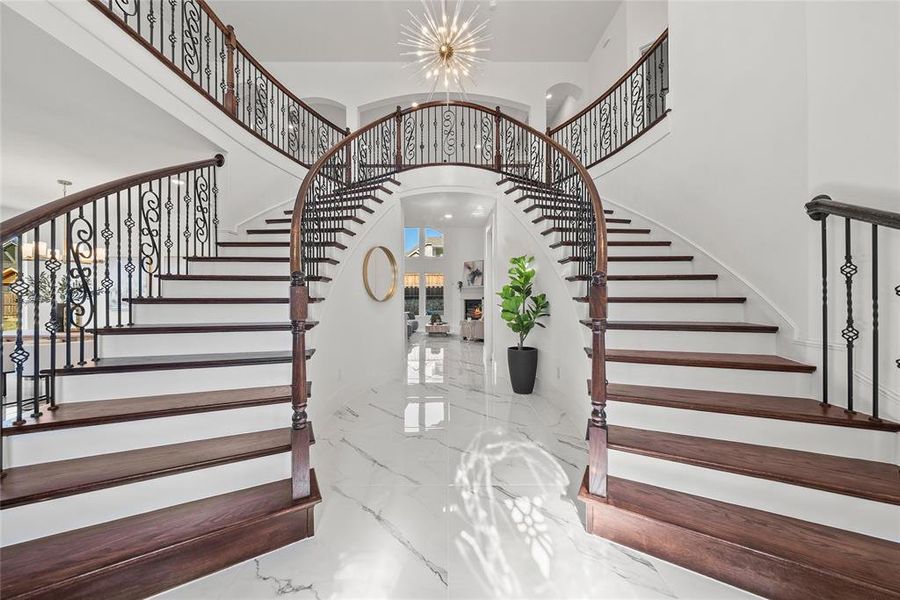 Grand double staircase & luxury chandelier