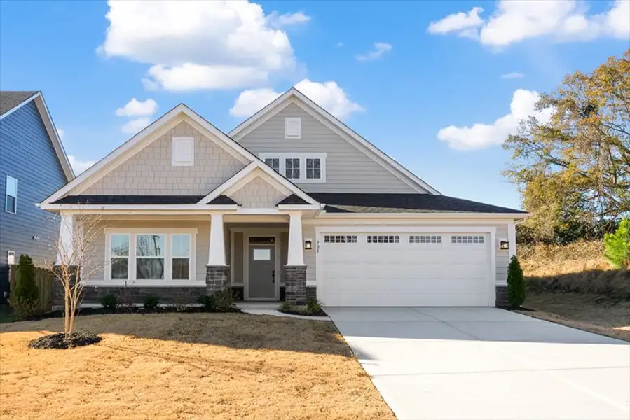 Front exterior of a new home in Canterbrook Farms Ranches, Fountain Inn, SC, highlighting curb appeal (Image 1). Front exterior of a new home in Canterbrook Farms Ranches, Fountain Inn, SC, highlighting curb appeal (Image 1).