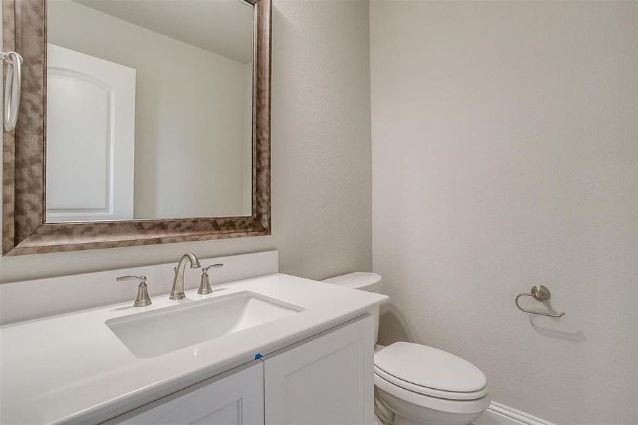 Bathroom with vanity and toilet