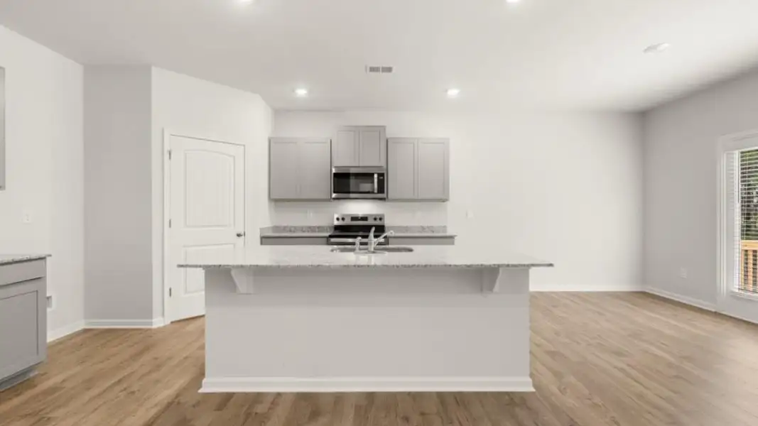 Furnished interior view inside a new home in Oaks at Cedar Grove, Fairburn (Image 5).
