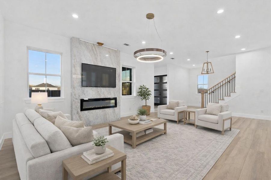 So much space in this gorgeous family room and dining room combination! Spectacular views of the back yard with elegant fixtures! This home is waiting on it's new owner!! This room has been virtually staged