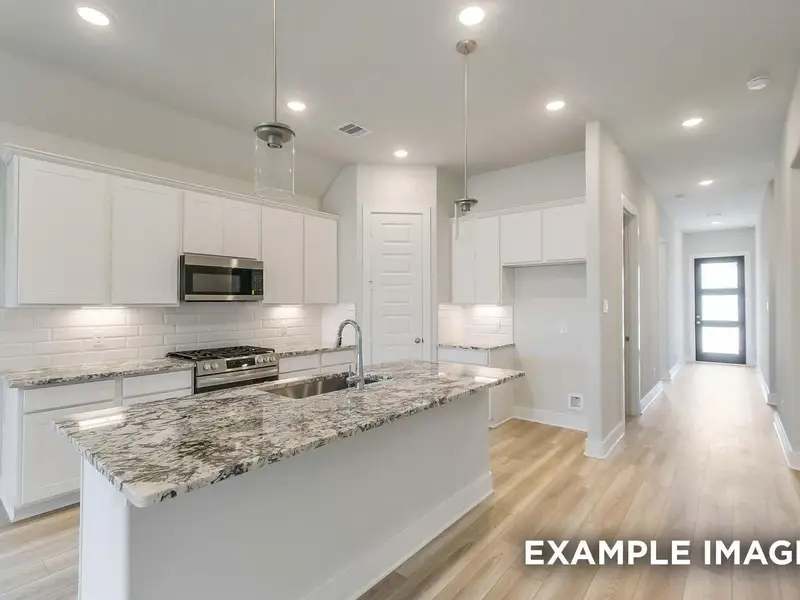 Furnished interior view inside a new home in Sunterra, Katy (Image 4).