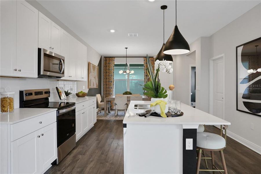 Furnished interior view inside a new home in Serenade at Ovation, Winter Garden (Image 16).