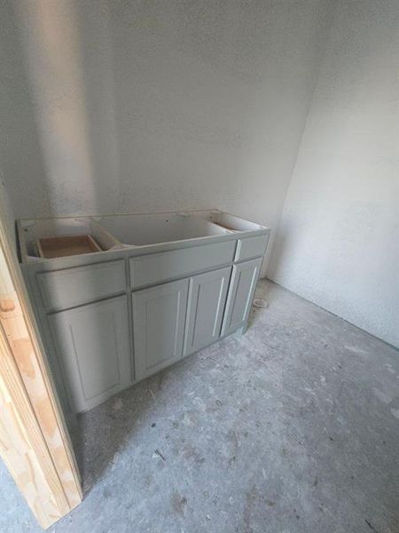 Full bath with unfinished concrete flooring