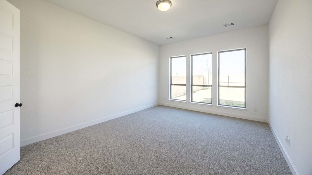 Spacious, unfurnished interior of a new home in The Colony, Bastrop (Image 6).