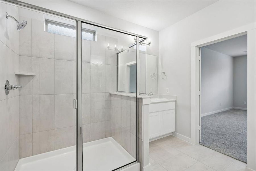 Primary Bathroom in the Winters home plan by Trophy Signature Homes – REPRESENTATIVE PHOTO