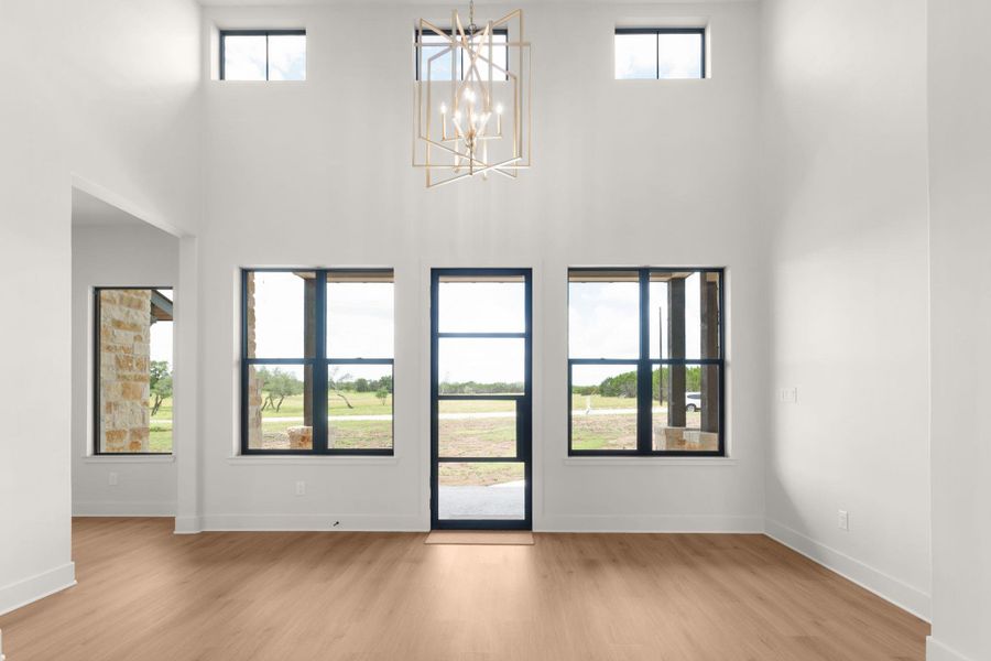 Inviting Entry featuring iron front door and 16' ceilings Inviting Entry featuring iron front door and 16' ceilings