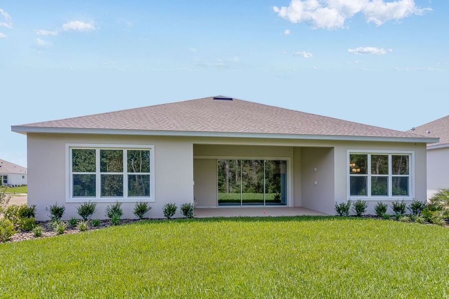 Representative exterior photo of a completed home built from the Letizia by Taylor Morrison in Esplanade at Center Lake Ranch, St. Cloud, FL (Image 20).