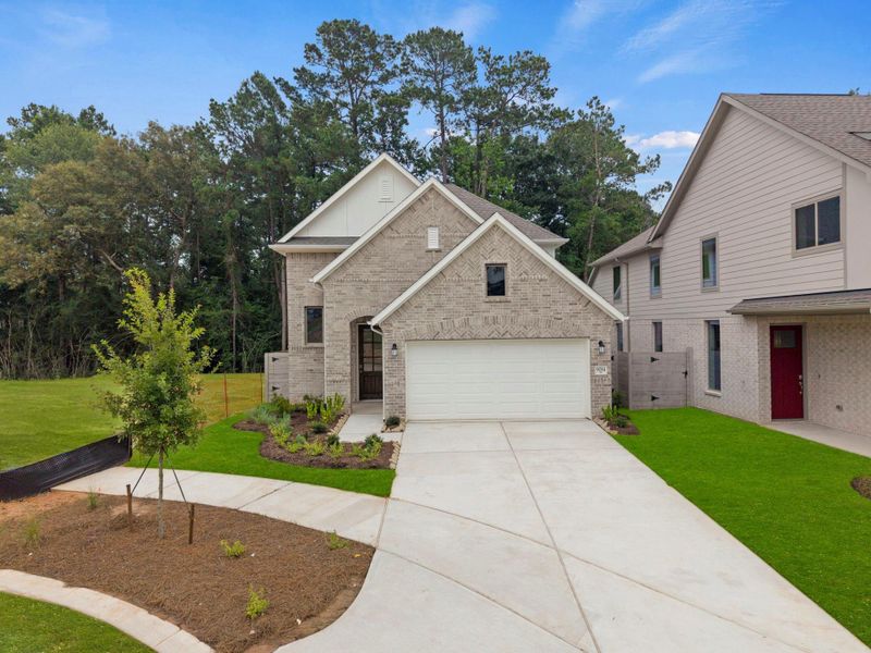 Front exterior of a new home in Two Step Farm, Montgomery, TX, highlighting curb appeal (Image 1). Front exterior of a new home in Two Step Farm, Montgomery, TX, highlighting curb appeal (Image 1).