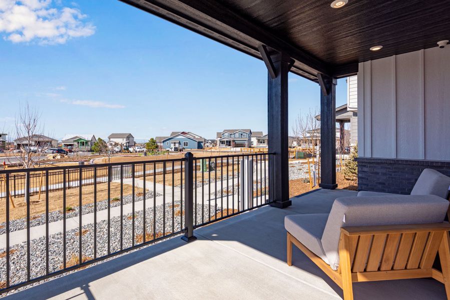 Exterior details and patio area of a home in Painted Prairie, Aurora (Image 22).