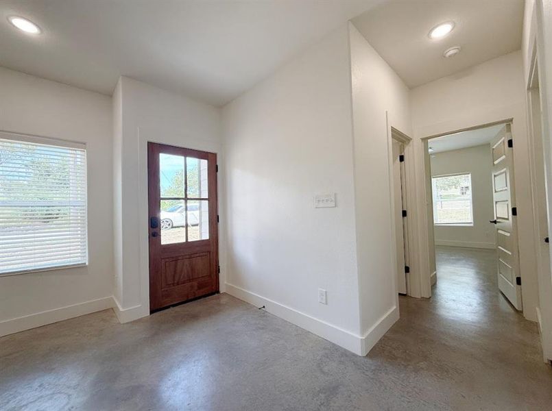 Foyer featuring recessed lighting and finished concrete floors Foyer featuring recessed lighting and finished concrete floors