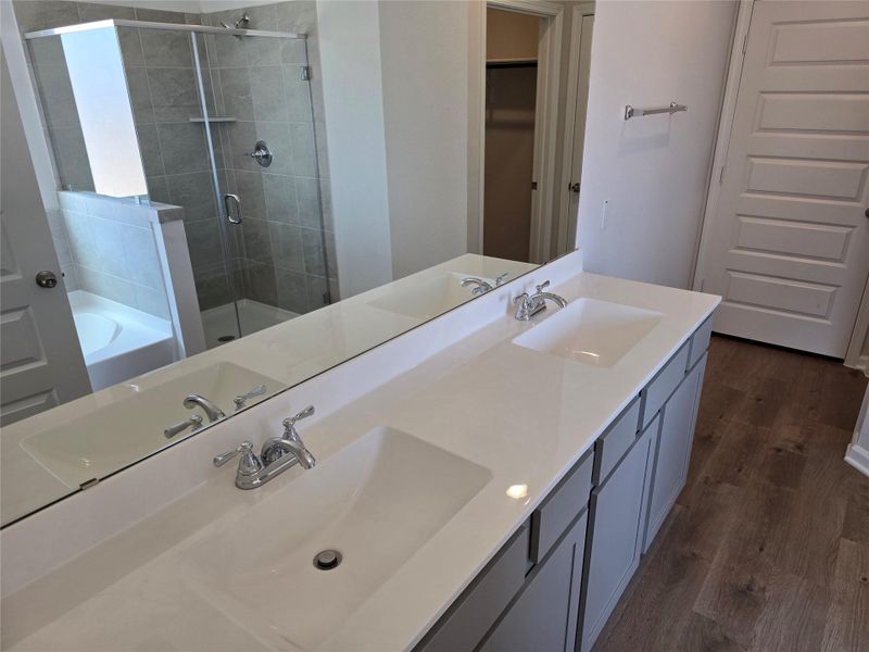 The Shetland III- Primary Bathroom with garden tub and dual sinks. Home under construction. Sample floor plan photo used for illustrative purposes only. Upgrades, selections options, windows and colors may vary. The Shetland III- Primary Bathroom with garden tub and dual sinks. Home under construction. Sample floor plan photo used for illustrative purposes only. Upgrades, selections options, windows and colors may vary.