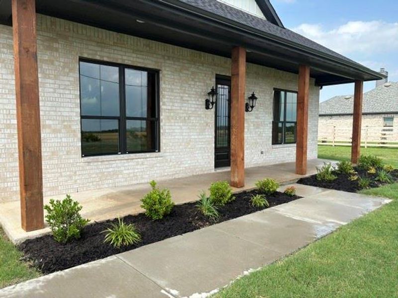 Front exterior of a new home in , Van Alstyne, TX, highlighting curb appeal (Image 22).