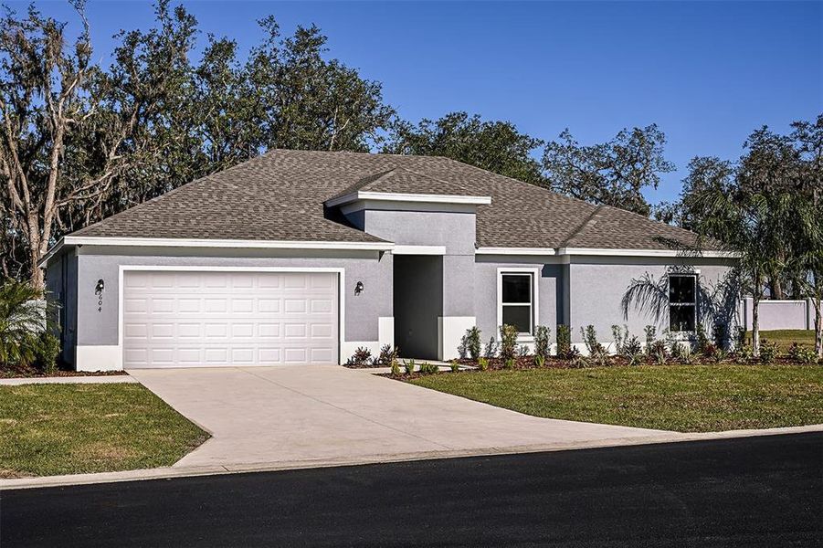 Front exterior of a new home in Grand Oaks, Avon Park, FL, highlighting curb appeal (Image 2). Front exterior of a new home in Grand Oaks, Avon Park, FL, highlighting curb appeal (Image 2).