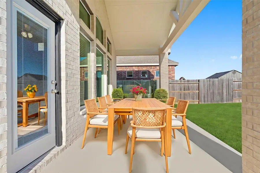 Virtually staged — Step outside to your covered patio—a relaxing outdoor retreat ideal for morning coffee, weekend barbecues, or unwinding in the fresh air. The spacious backyard offers endless opportunities for entertaining or playtime under the Texas sun.