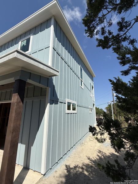 Front exterior of a new home in , Canyon Lake, TX, highlighting curb appeal (Image 5). Front exterior of a new home in , Canyon Lake, TX, highlighting curb appeal (Image 5).