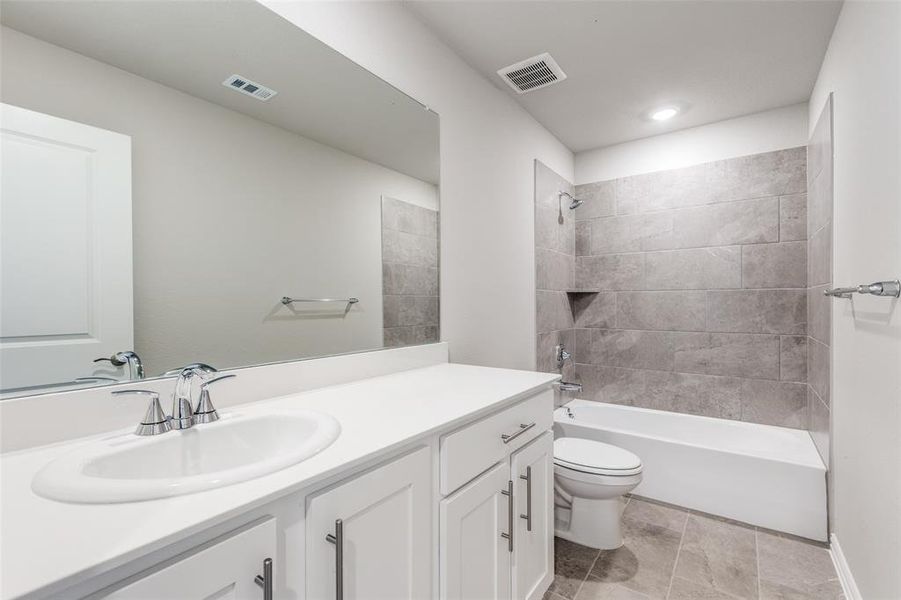 Full bathroom with tub / shower combination and vanity Full bathroom with tub / shower combination and vanity