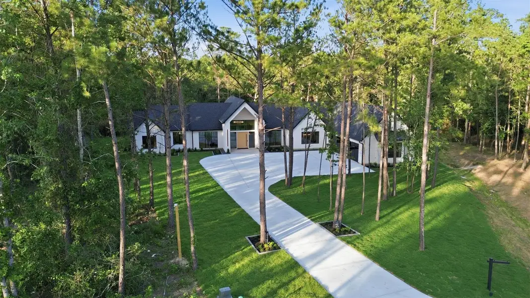 Front exterior of a new home in , Montgomery, TX, highlighting curb appeal (Image 22).