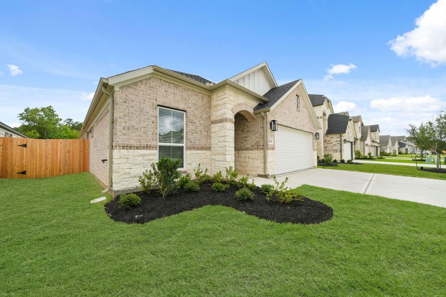 Front exterior of a new home in Barton Creek Ranch, Conroe, TX, highlighting curb appeal (Image 16). Front exterior of a new home in Barton Creek Ranch, Conroe, TX, highlighting curb appeal (Image 16).