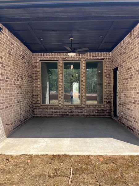 Exterior details and patio area of a home in Wildtree, Magnolia (Image 3).