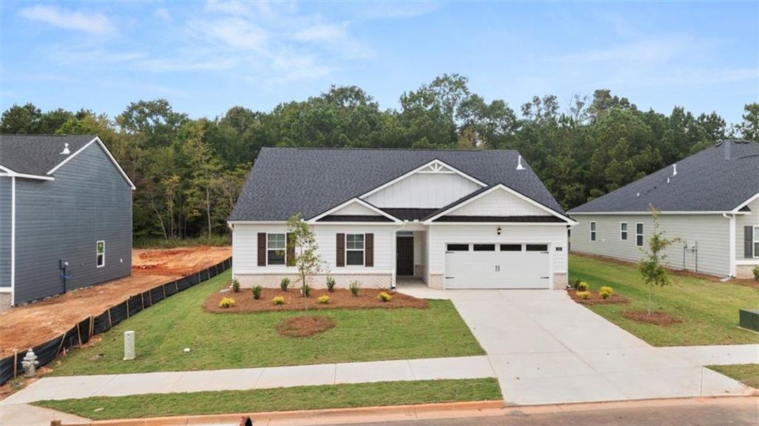 Front exterior of a new home in Preserve at Dove Creek, Statham, GA, highlighting curb appeal (Image 25).