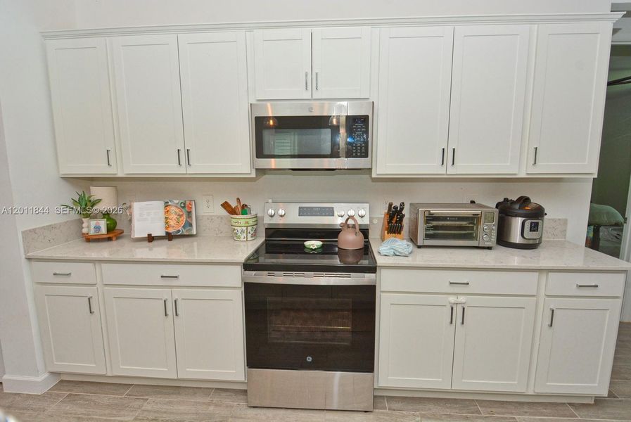 Furnished interior view inside a new home in Central Park, Port St. Lucie (Image 9).