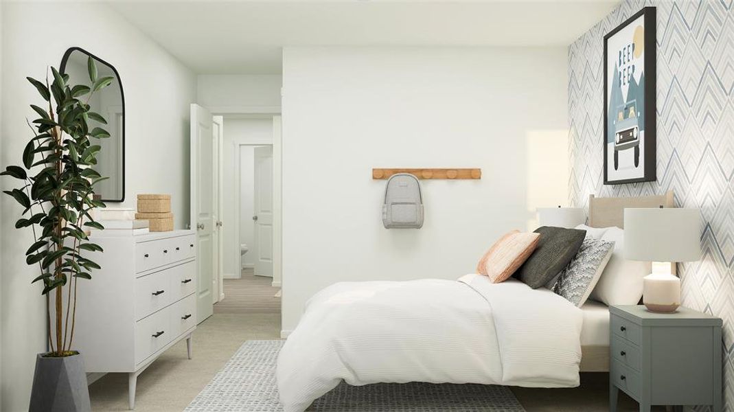 Bedroom featuring light carpet and ensuite bathroom