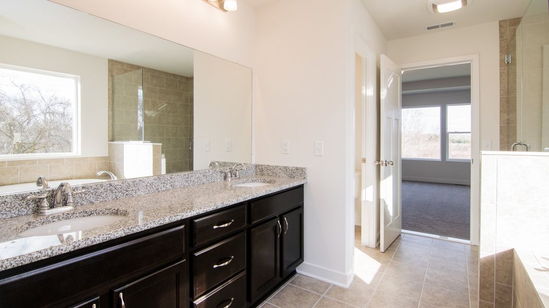 Representative furnished interior of a home built from the The Hartland by Norfolk Homes in Coronado Estates, Jackson (Image 42).