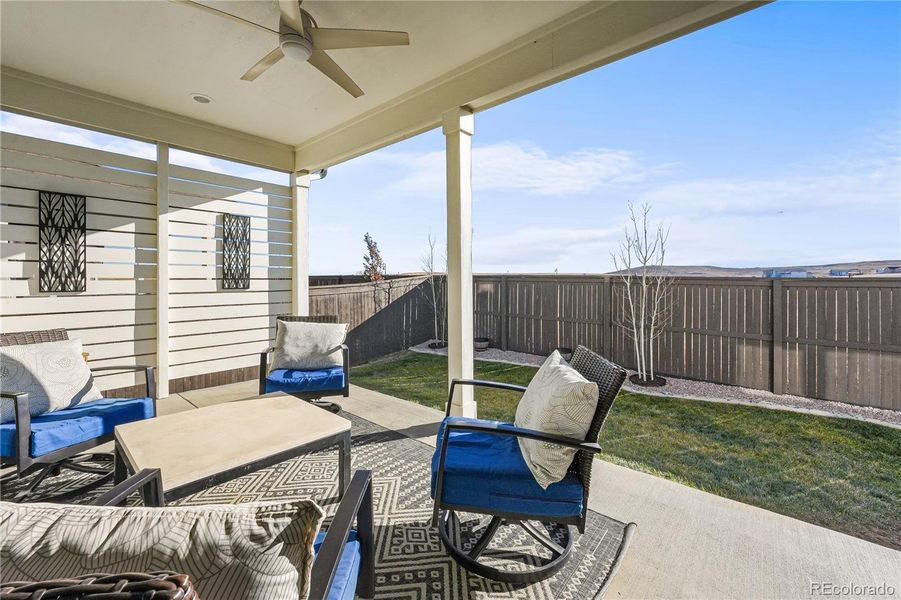 Covered Patio: Outdoor living space for dining or entertaining.