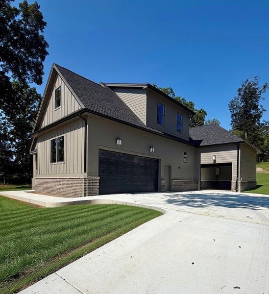 Front exterior of a new home in Baker Road, Birchwood, TN, highlighting curb appeal (Image 26).