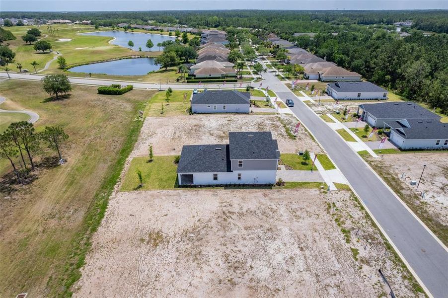 Front exterior of a new home in Gray Hawk at Hole Two, Daytona Beach, FL, highlighting curb appeal (Image 35). Front exterior of a new home in Gray Hawk at Hole Two, Daytona Beach, FL, highlighting curb appeal (Image 35).