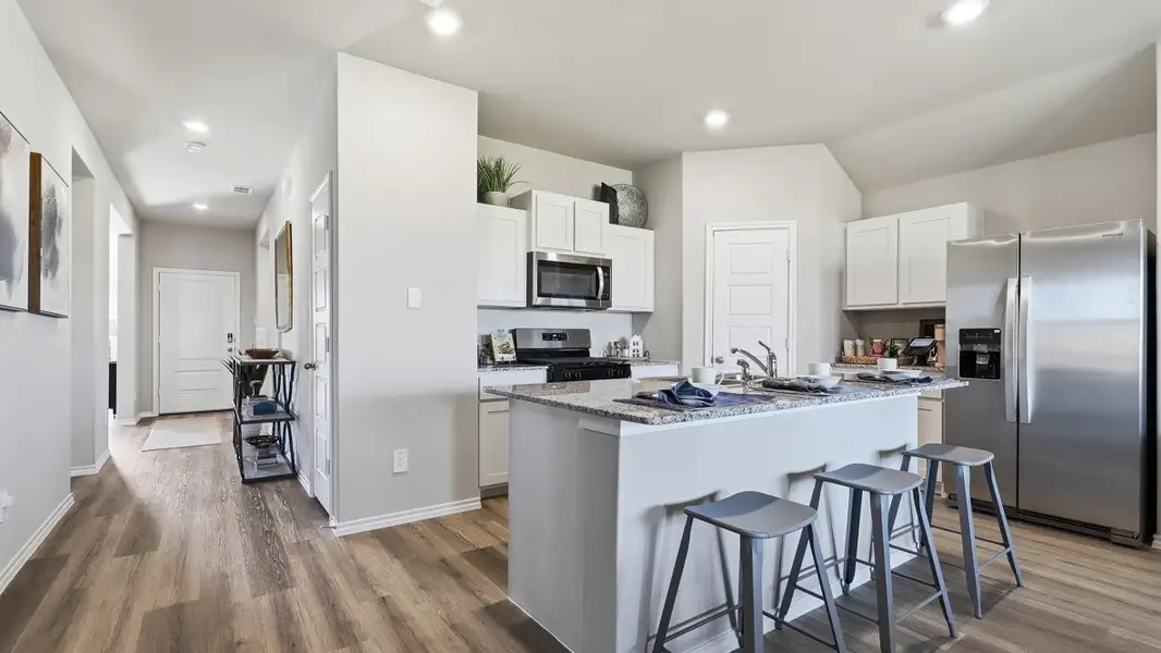 Representative furnished interior of a home built from the Plan by D.R. Horton in Bella Vista, Granbury (Image 5).