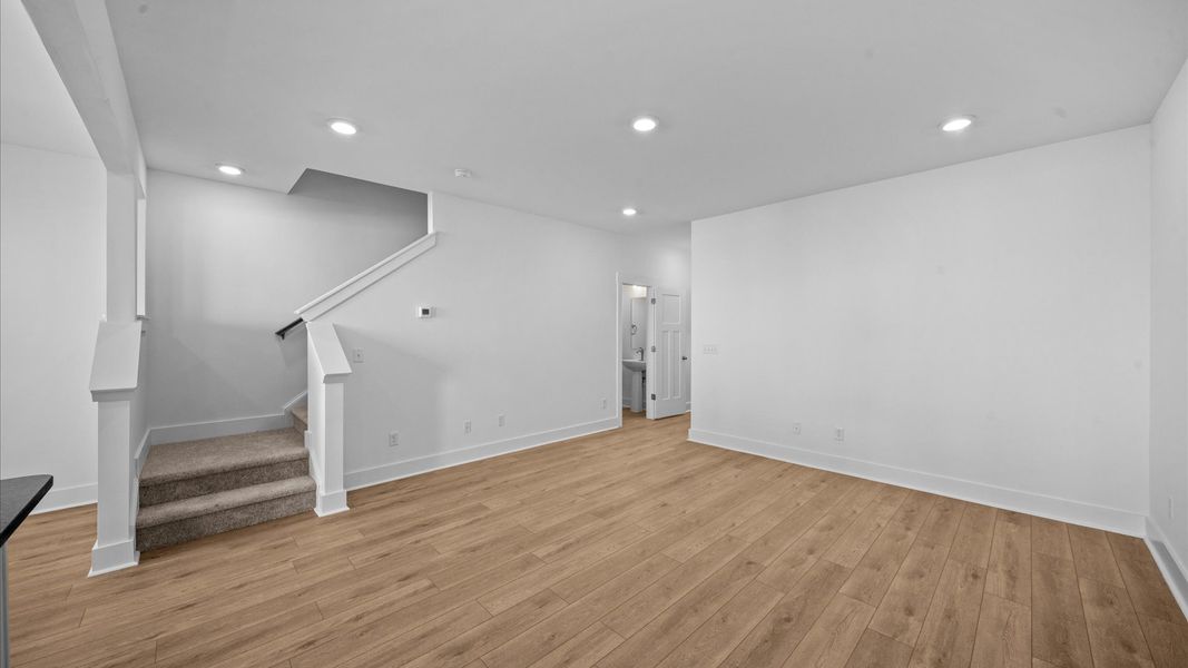 Exceptional family room with hardwood flooring in this exclusive Greenville-area townhome Exceptional family room with hardwood flooring in this exclusive Greenville-area townhome