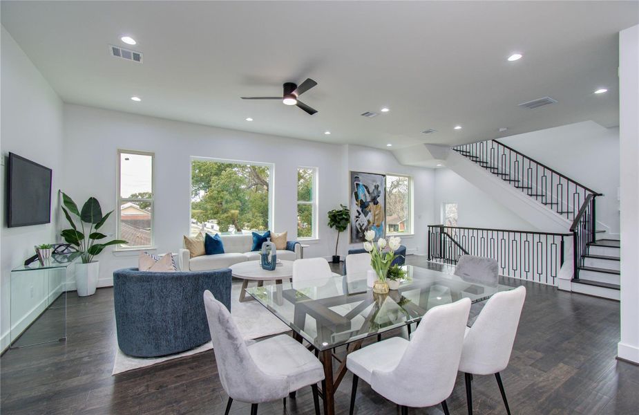 Large windows that allow plenty of natural light and frame the beautiful trees that surround the property.