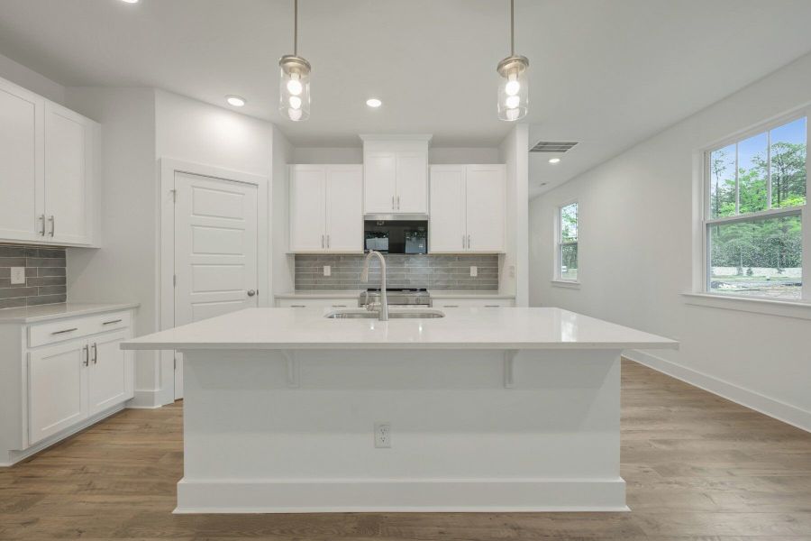 Furnished interior view inside a new home in Ashmore Townes, Garner (Image 3). Furnished interior view inside a new home in Ashmore Townes, Garner (Image 3).