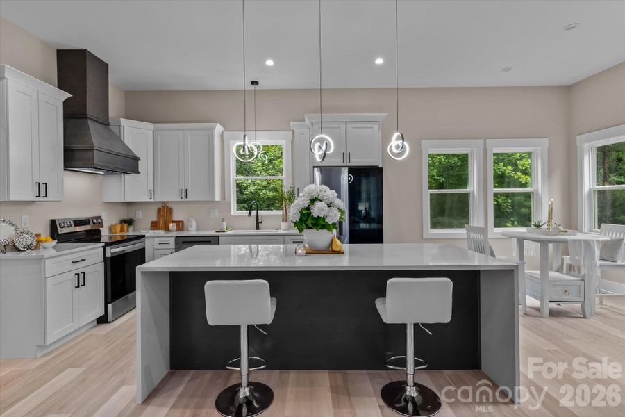 Kitchen w/waterfall quartz accent island