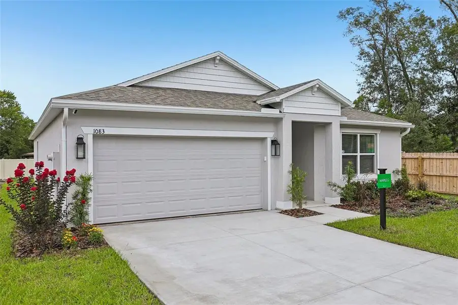 Front exterior of a new home in , Poinciana, FL, highlighting curb appeal (Image 1). Front exterior of a new home in , Poinciana, FL, highlighting curb appeal (Image 1).