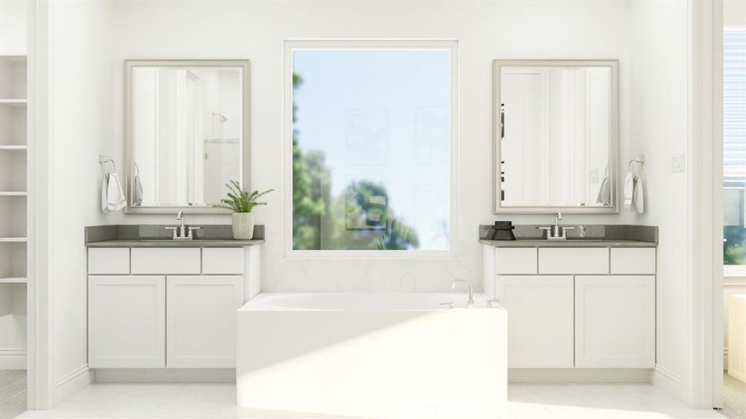 Bathroom featuring dual vanity, a wealth of natural light, and a tub to relax in