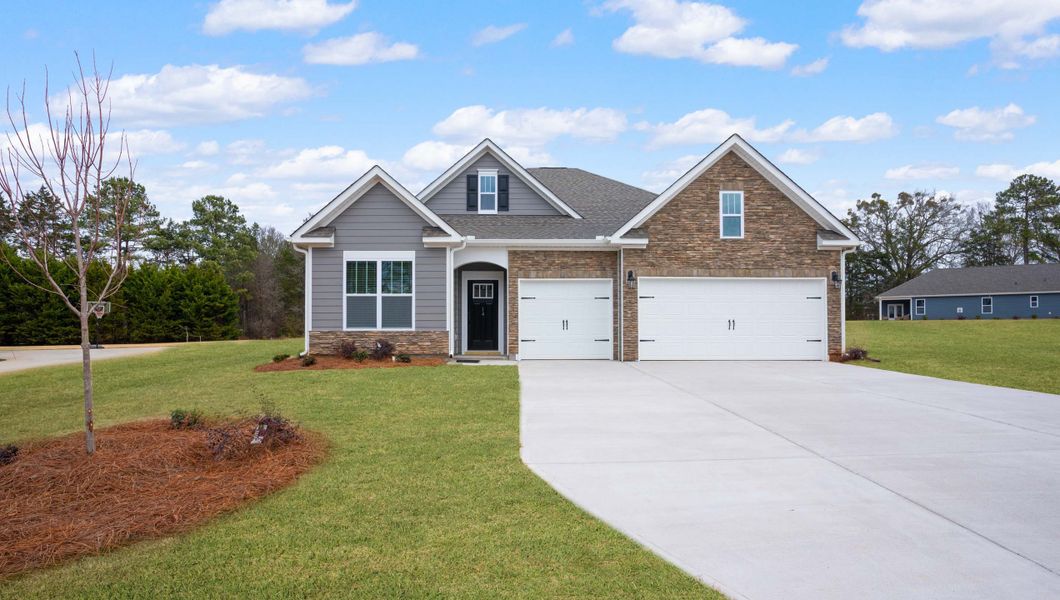 Front exterior of a new home in Arrowood Acres, Enoree, SC, highlighting curb appeal (Image 1). Front exterior of a new home in Arrowood Acres, Enoree, SC, highlighting curb appeal (Image 1).