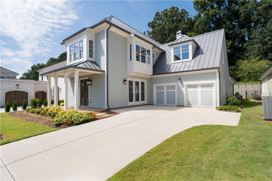 Front exterior of a new home in Vickery, Cumming, GA, highlighting curb appeal (Image 23).