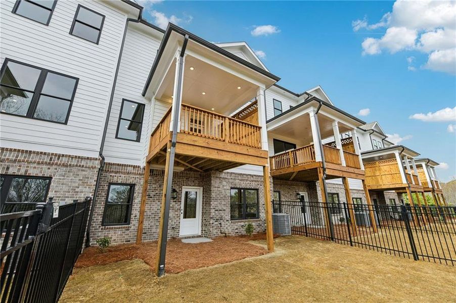 Exterior details and patio area of a home in Millcroft Townhomes, Buford (Image 24). Exterior details and patio area of a home in Millcroft Townhomes, Buford (Image 24).