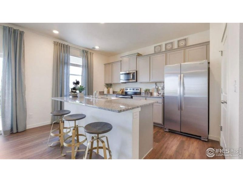 Furnished interior view inside a new home in Fossil Creek Ranch, Windsor (Image 7).