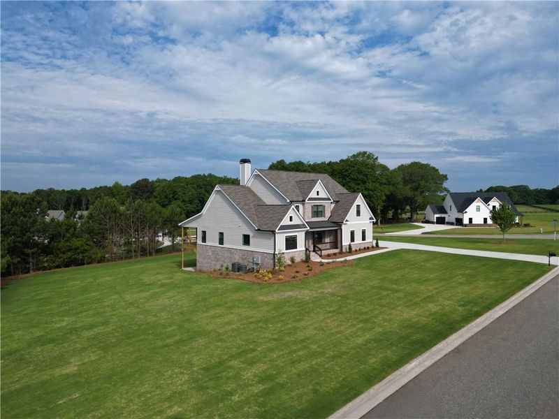 Front exterior of a new home in Stonegate, Monroe, GA, highlighting curb appeal (Image 23).