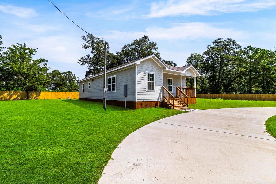 Front exterior of a new home in , Livingston, TX, highlighting curb appeal (Image 19). Front exterior of a new home in , Livingston, TX, highlighting curb appeal (Image 19).