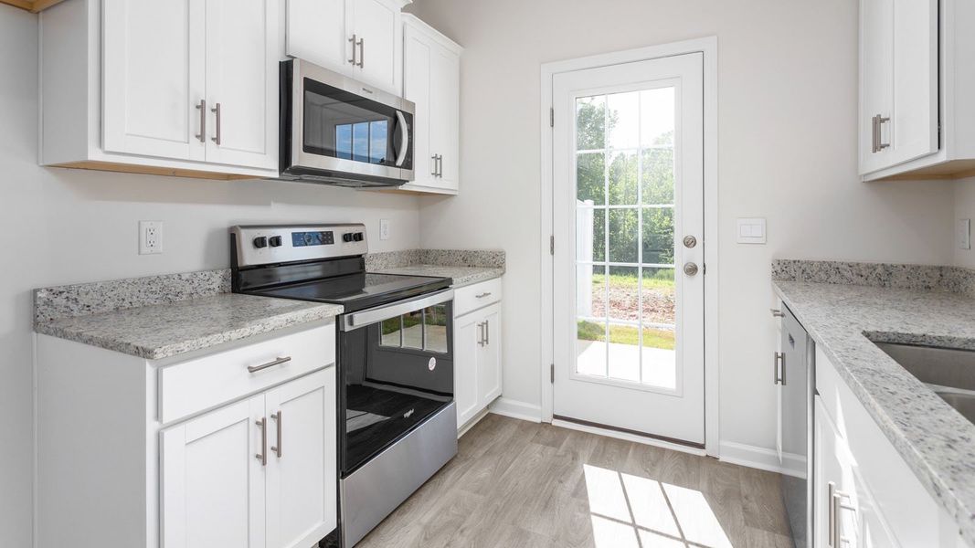 Representative furnished interior of a home built from the NEWTON by D.R. Horton in Henley Ridge, Graham (Image 7).