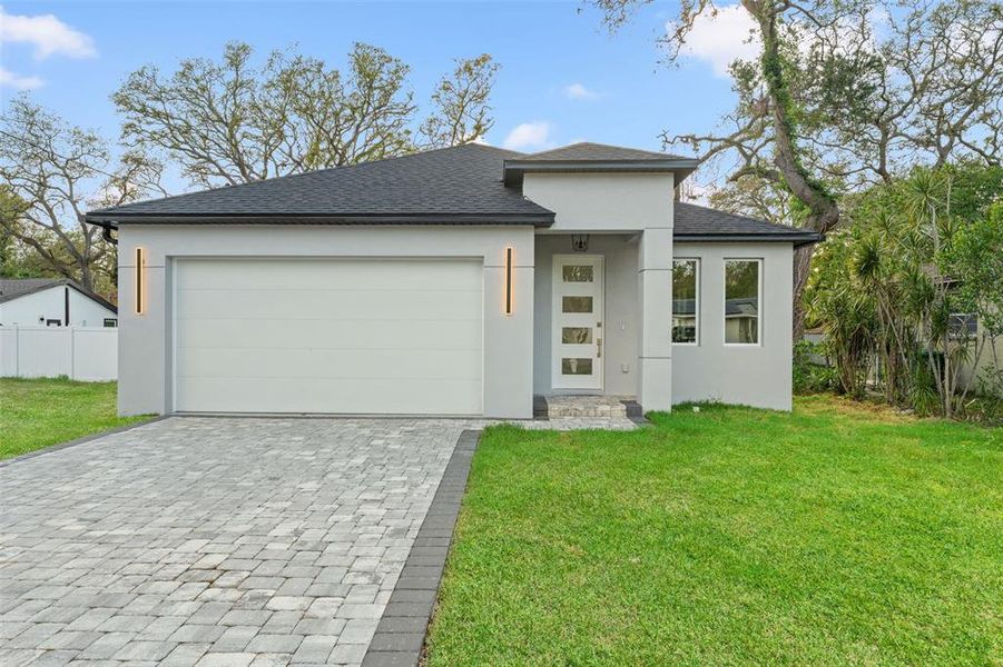 Front exterior of a new home in , Tampa, FL, highlighting curb appeal (Image 1).
